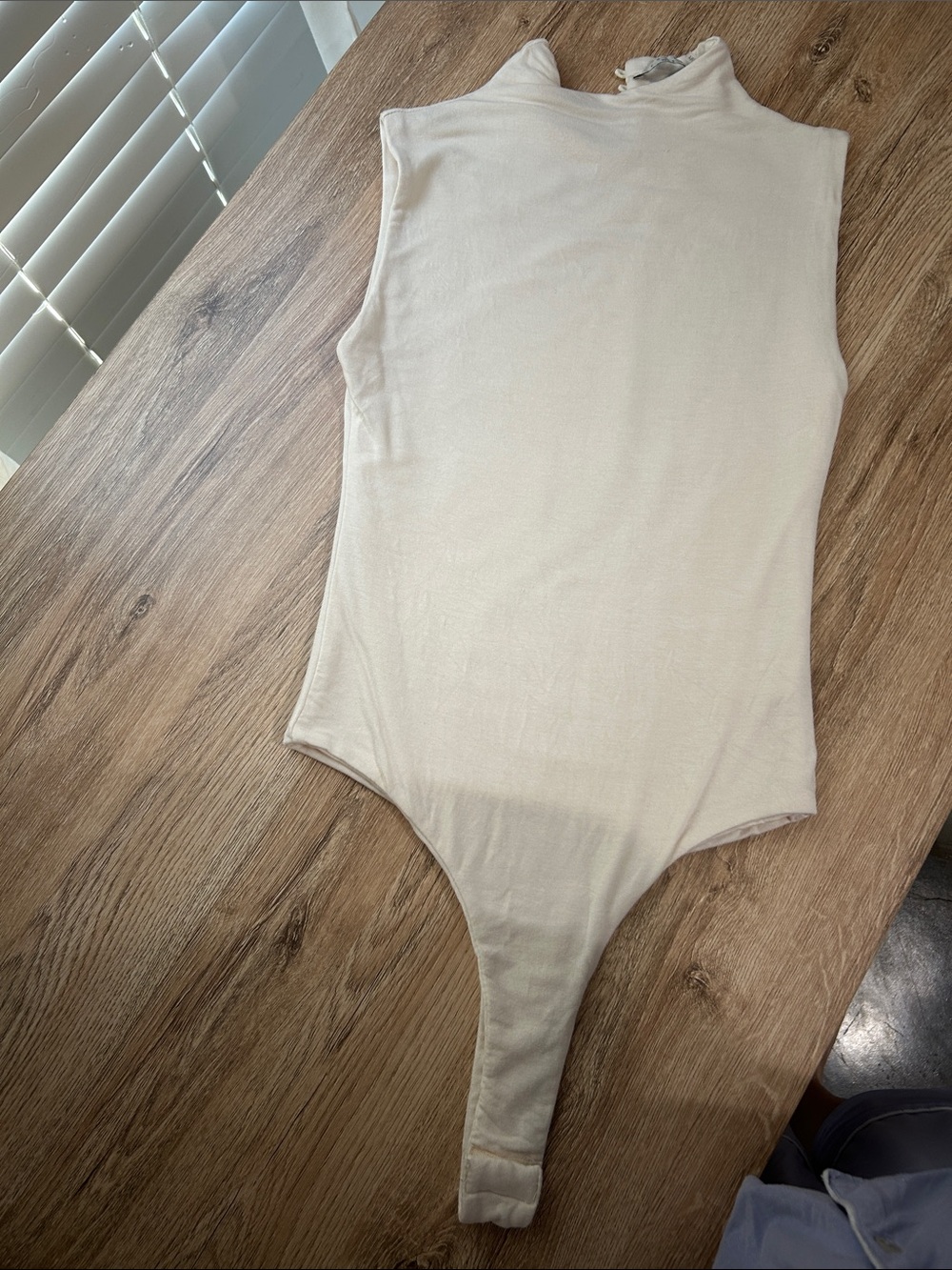 Cream One-Piece Bodysuit